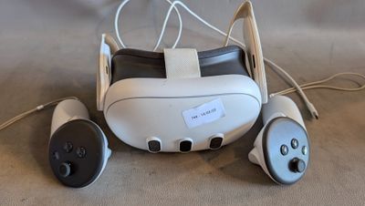 a remote control and a pair of headphones on a table