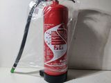 a red fire extinguisor sitting on a counter
