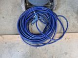 a blue hose attached to a cart on the floor