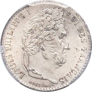 a silver coin with a woman ' s head on it