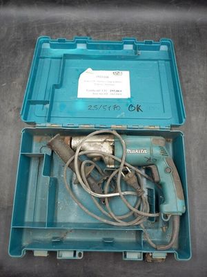 a blue box with a drill and a cord in it