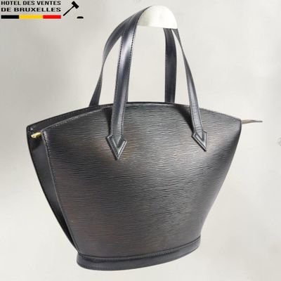 a close up of a black handbag on a white background