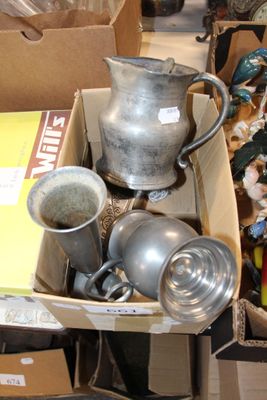 a box full of silver items on the floor