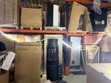a man that is standing in a room with a lot of boxes