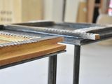 two pieces of wood sitting on top of a table