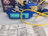 a small blue toy truck with a yellow cord attached to it