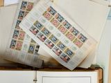 a lot of different stamps on the pages of a book