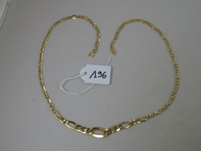 a close up of a gold chain with a price tag on it