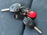 a bunch of keys that are laying on the seat of a car