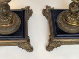 two candles that are sitting on top of each other
