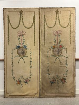 pair of antique embroidered panels with flowers and birds on them
