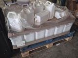 many containers of water sitting on a pallet in a warehouse