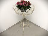 a potted plant sitting on top of a metal stand