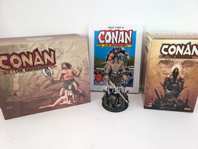 three boxes of comics and a figurine of a man on a motorcycle