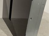 a black computer sitting on top of a white table