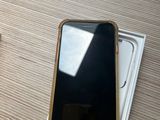 a cell phone sitting on top of a box on a table