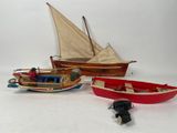 three small boats that are sitting next to each other