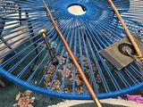 a blue table with a blue umbrella on top of it