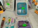 many different types of scissors and other items on the table