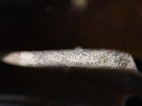 a close up of a person ' s hand holding a piece of paper