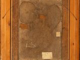 an old picture of a dog in a wooden frame on a wall
