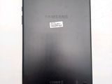 the back of a black samsung tablet with a sticker on it