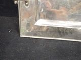a man taking a picture of himself in a mirror