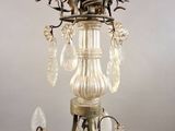 a chandelier that has a glass rose on it