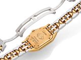 an image of a gold and silver watch on a white background