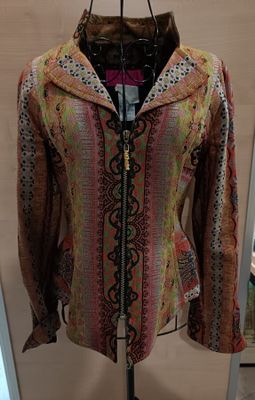 a jacket on a mannequin stand in a room