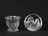 two glass vases that are sitting next to each other