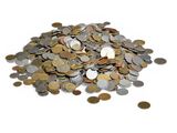 a pile of coins sitting on top of a white surface