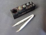 two pencils and a pair of scissors on a table