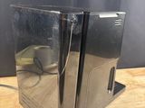 an image of a black computer case on a wooden table