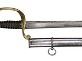 an old sword with a gold handle and a black handle