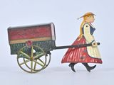 figurine représentant une femme tirant une charrette tirée par un cheval