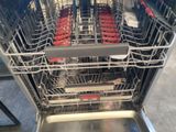 a picture of a dishwasher full of empty dishes