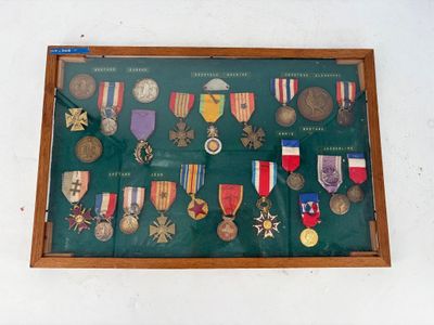 a display of medals and medals on display in a wooden frame