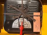 a black box with a red handle and a black box with a red handle and a black box with a red handle and a yellow box with a red