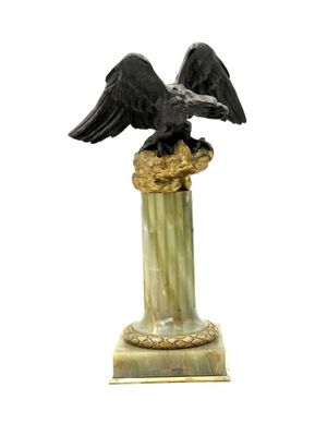 Porte-montres représentant un aigle en bronze à double patin…