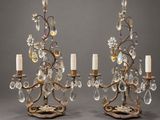 a pair of antique brass and crystal candelabs