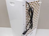 a white refrigerator with a cord attached to it