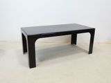 an image of a black coffee table on a white floor