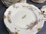 a lot of plates that are sitting on a table