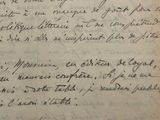 une vieille lettre manuscrite à l'encre noire sur une feuille de papier