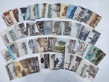 a lot of old postcards that are on a table