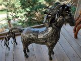 a statue of a horse on the porch of a house
