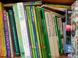 many books that are on a shelf in a book case