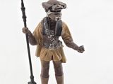 figurine of a man with a rifle and a hat