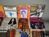 a lot of records that are on a table